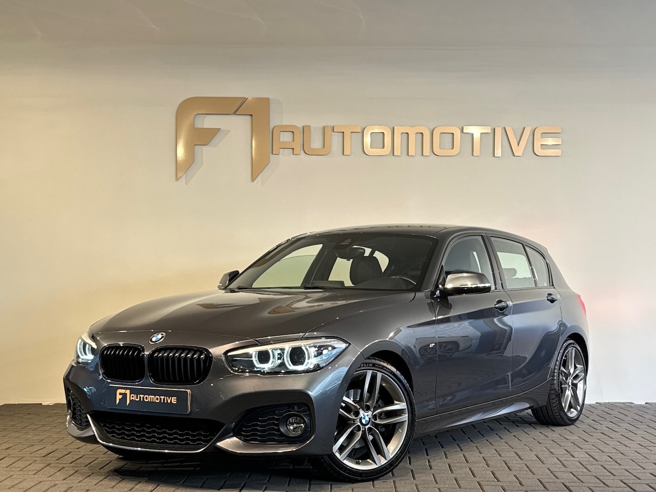BMW 1-serie - 120i High Executive M Sport Leer|Camera|Lane Assist - AutoWereld.nl