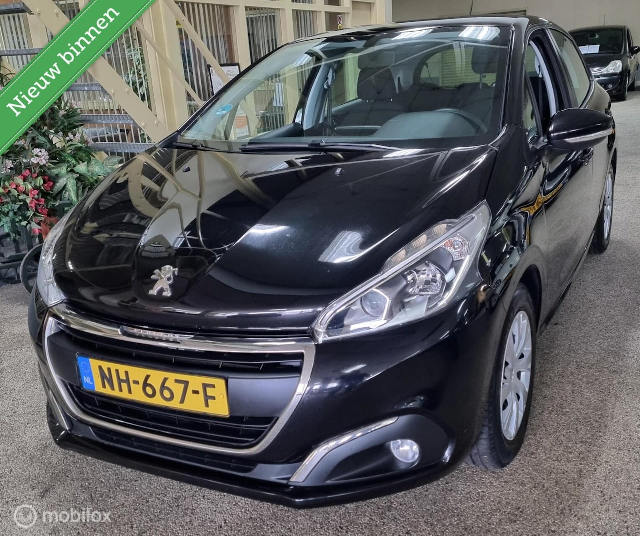 Peugeot 208 - 1.2 PureTech Blue Lion Navi - AutoWereld.nl