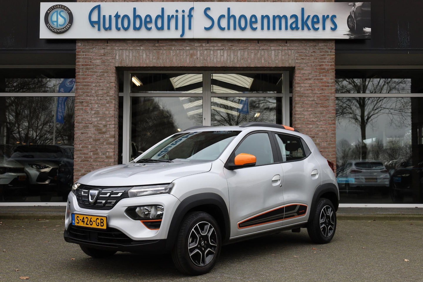 Dacia Spring - Comfort Plus (Orange Pack) 27 kWh SOH=91% LEER DAB NAVI CRUISE BT-TELEFOONVERB. VOICE PDC - AutoWereld.nl
