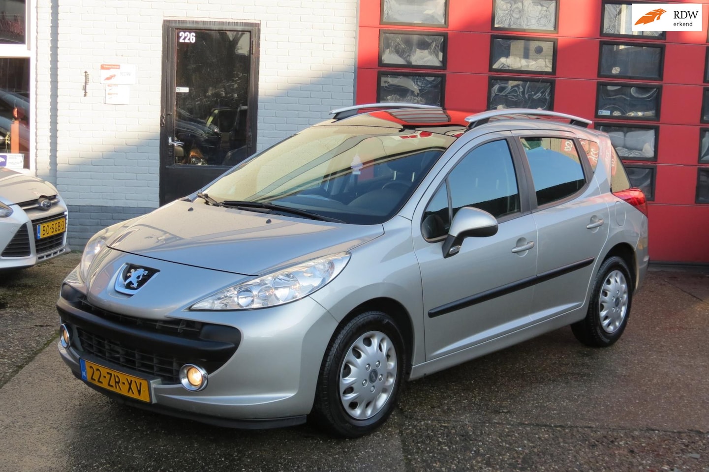 Peugeot 207 SW - 1.6 VTi XS 1.6 VTi XS , AUTOMAAT , PANO , PDC , AIRCO - AutoWereld.nl