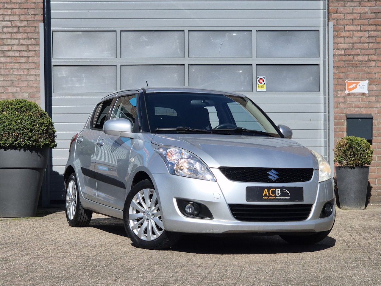 Suzuki Swift - 1.2 Exclusive EASSS Trekhaak / Airco - AutoWereld.nl