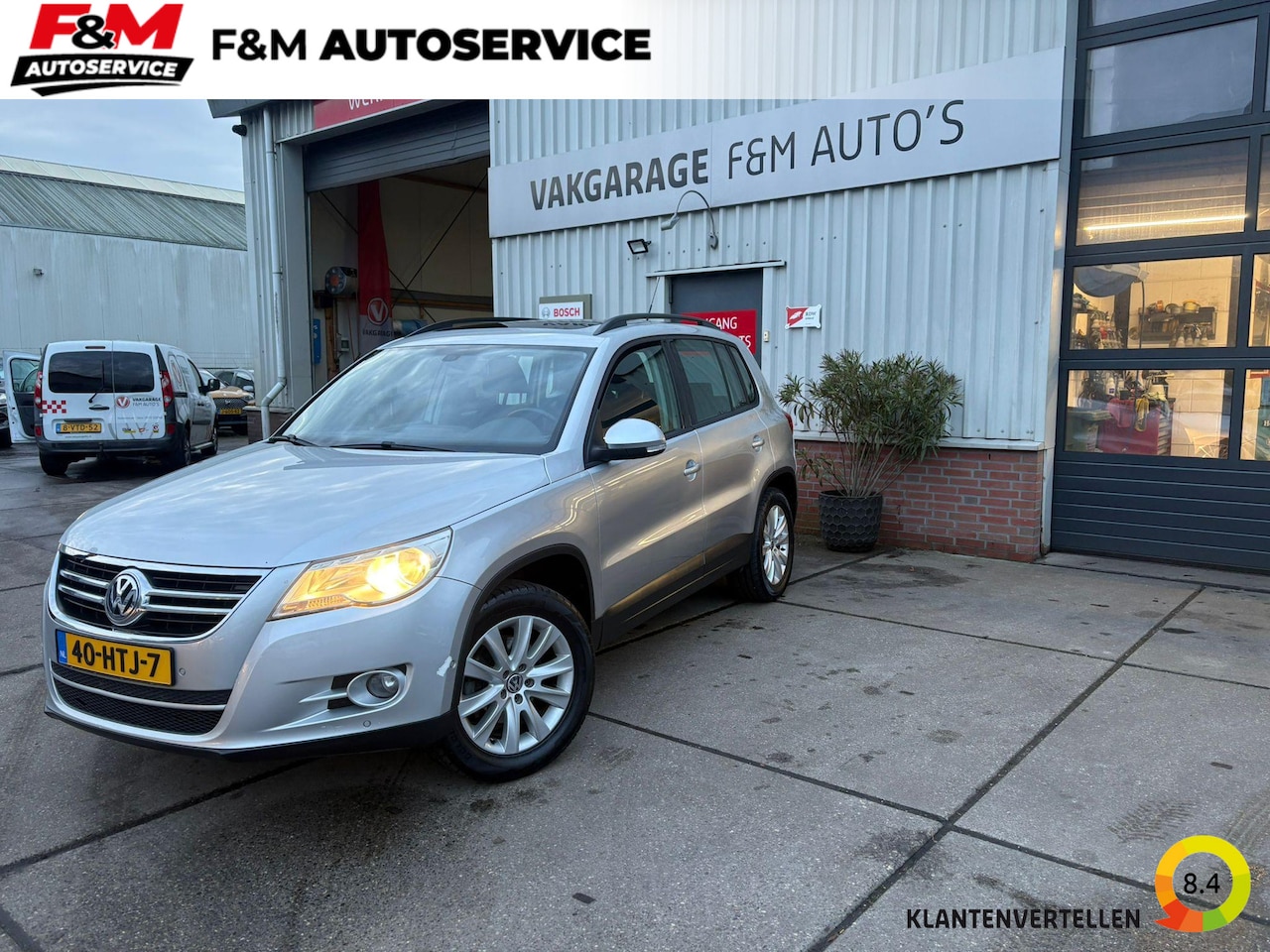 Volkswagen Tiguan - 1.4 TSI Comfort&Design Airco, trekhaak, pano, navi - AutoWereld.nl