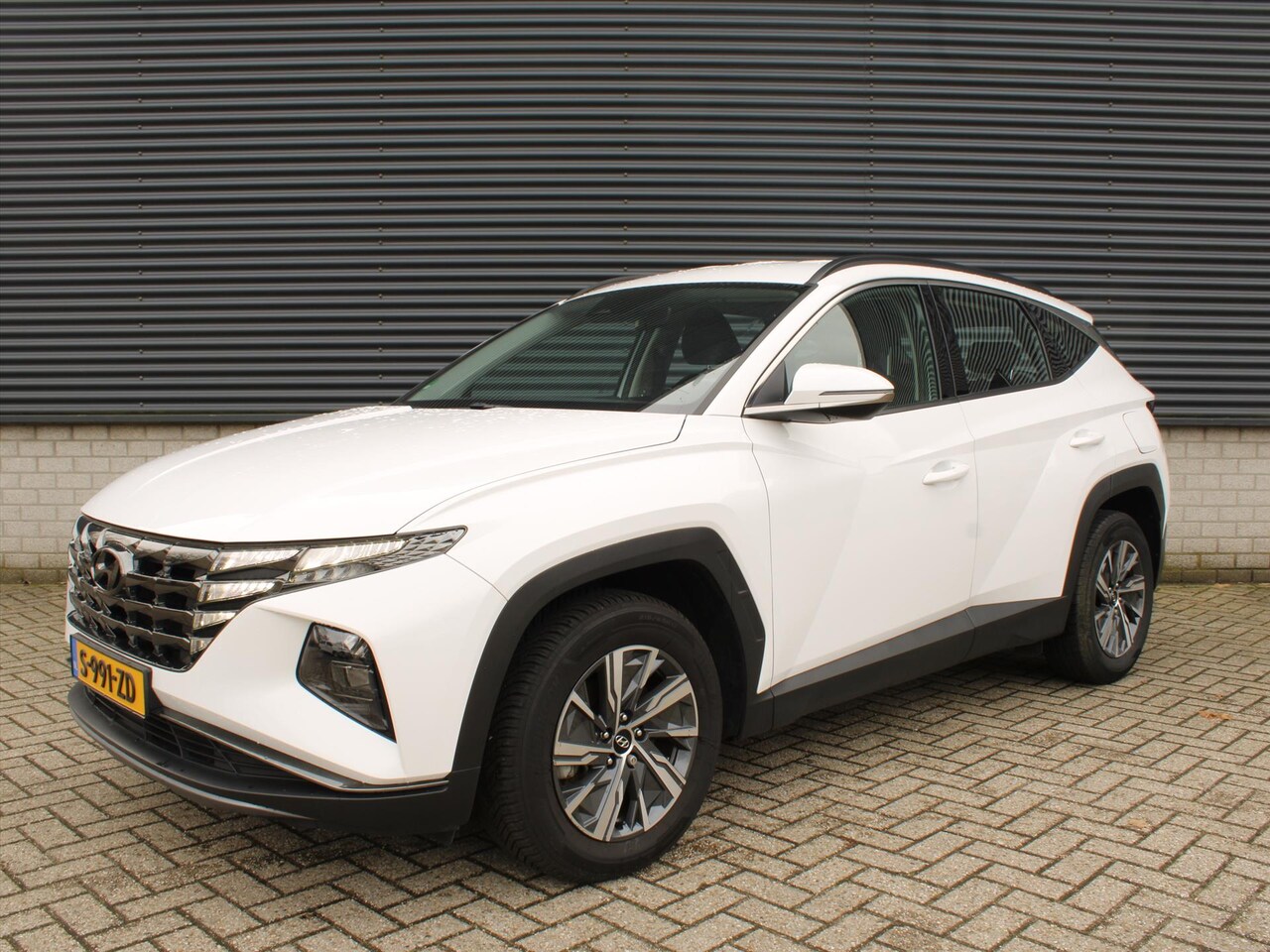 Hyundai Tucson - Comfort 1.6 T-GDi HEV 230pk Automaat I Adaptive Cruise Control I Camera I Trekhaak - AutoWereld.nl