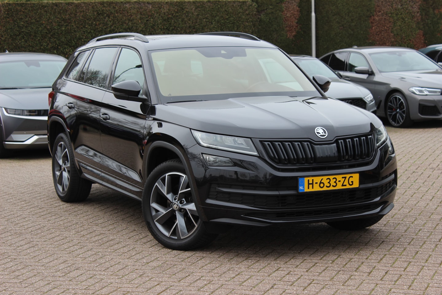 Skoda Kodiaq - 1.5 TSI Sportline Business / Camera / Keyless / Sportstoelen / CarPlay / 19'' / Blackpack - AutoWereld.nl
