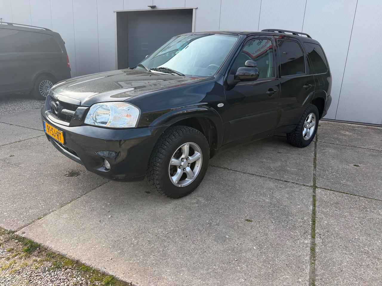 Mazda Tribute - 2.3i Touring 4x4 met terrein banden - AutoWereld.nl