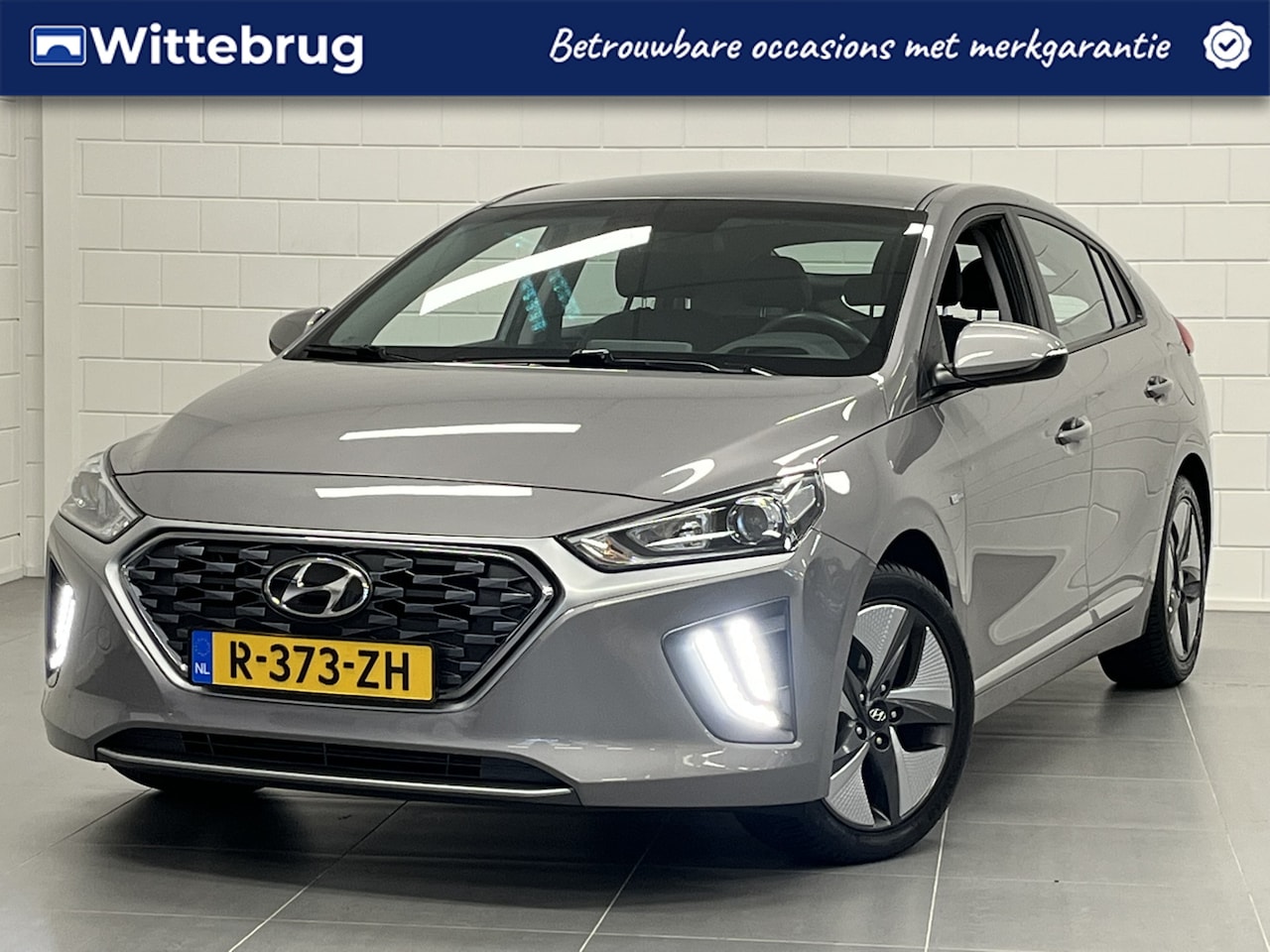 Hyundai IONIQ - 1.6 GDi i-Motion - Plus APPLE / ANDROID NAVIGATIE | PARKEERCAMERA | ZUINIGE RUIME HYBRIDE! - AutoWereld.nl