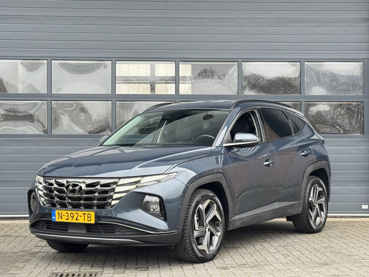 Hyundai Tucson - 1.6 T-GDI HEV PREMIUM I AUTOMAAT I TREKHAAK I APPLE CARPLAY I LEDEREN BEKLEDING - AutoWereld.nl