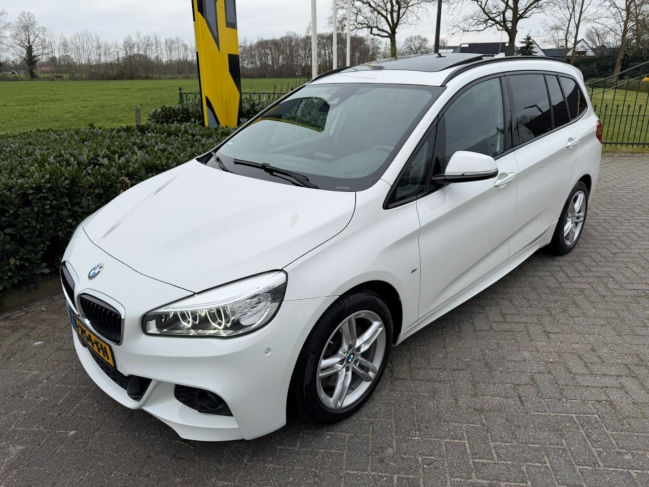 BMW 2-serie Gran Tourer - 220 High Executive M Sport Aut.8 Pano / Keyless - AutoWereld.nl