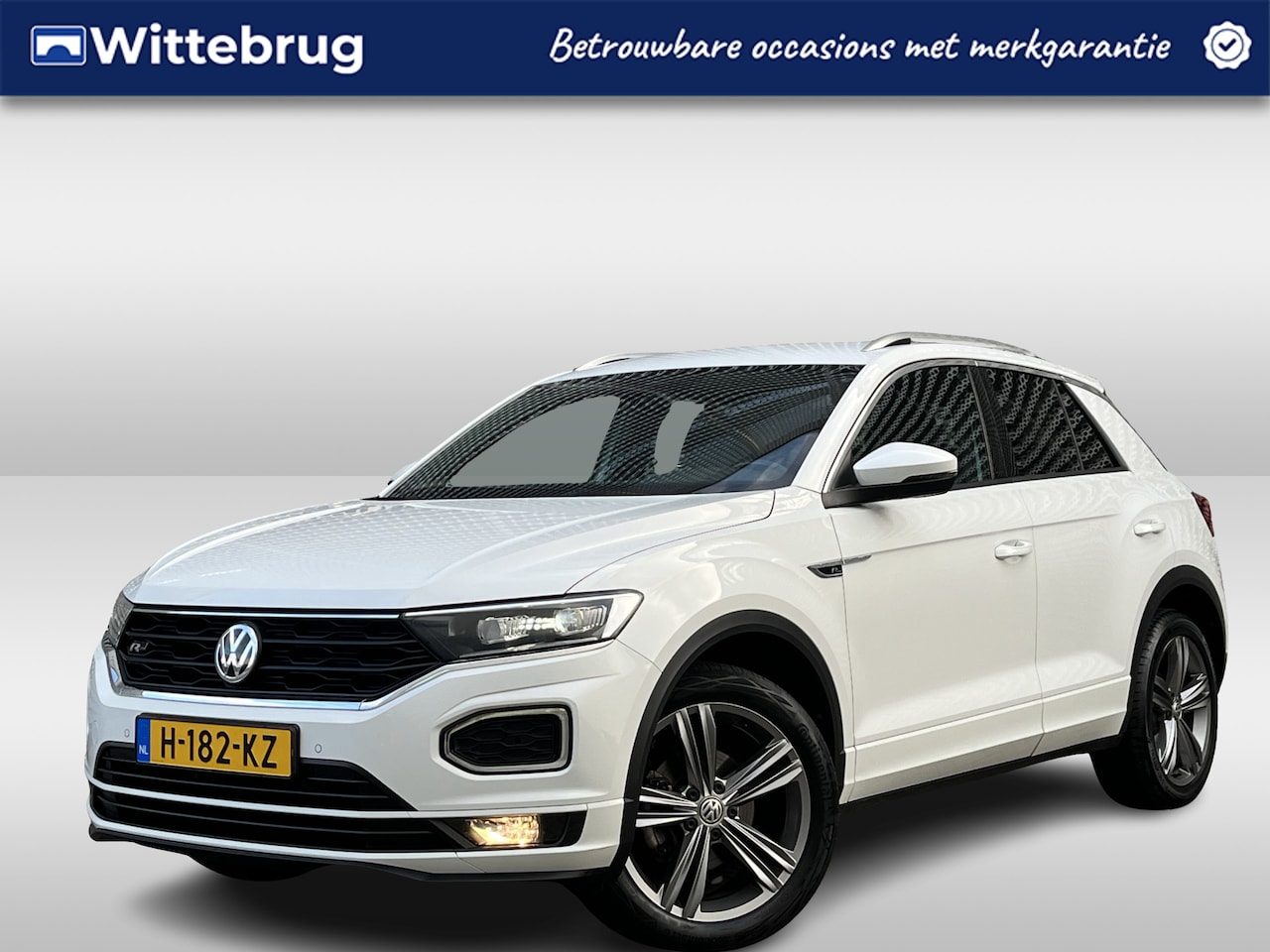 Volkswagen T-Roc - 1.5 TSI R-line / Digitaal dashboard / Navigatie / 2x R-line / Afneembare trekhaak / Parkee - AutoWereld.nl