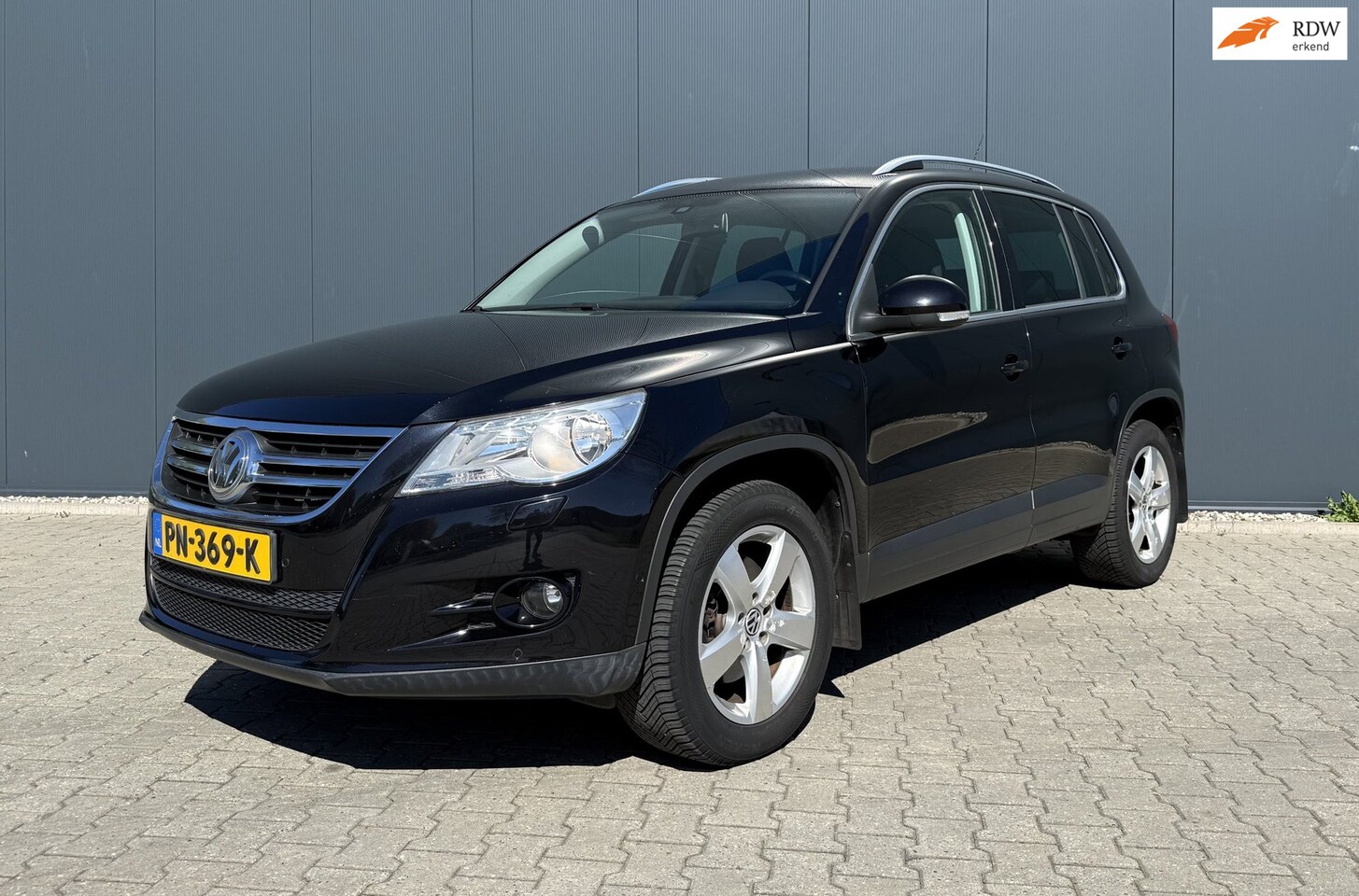 Volkswagen Tiguan - 1.4 TSI Sport&Style 4Motion Airco Cruise Trekhaak - AutoWereld.nl
