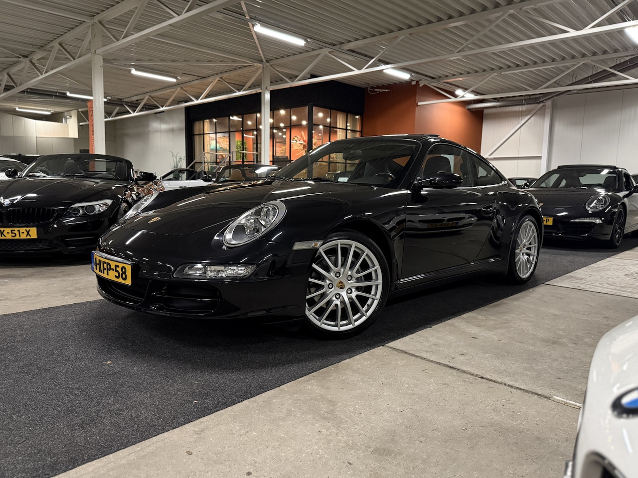 Porsche 911 - [997] 3.6 Carrera 4 Coupé Aut. l Schuifdak l Xenon l CarPlay l Sport-uitlaat - AutoWereld.nl