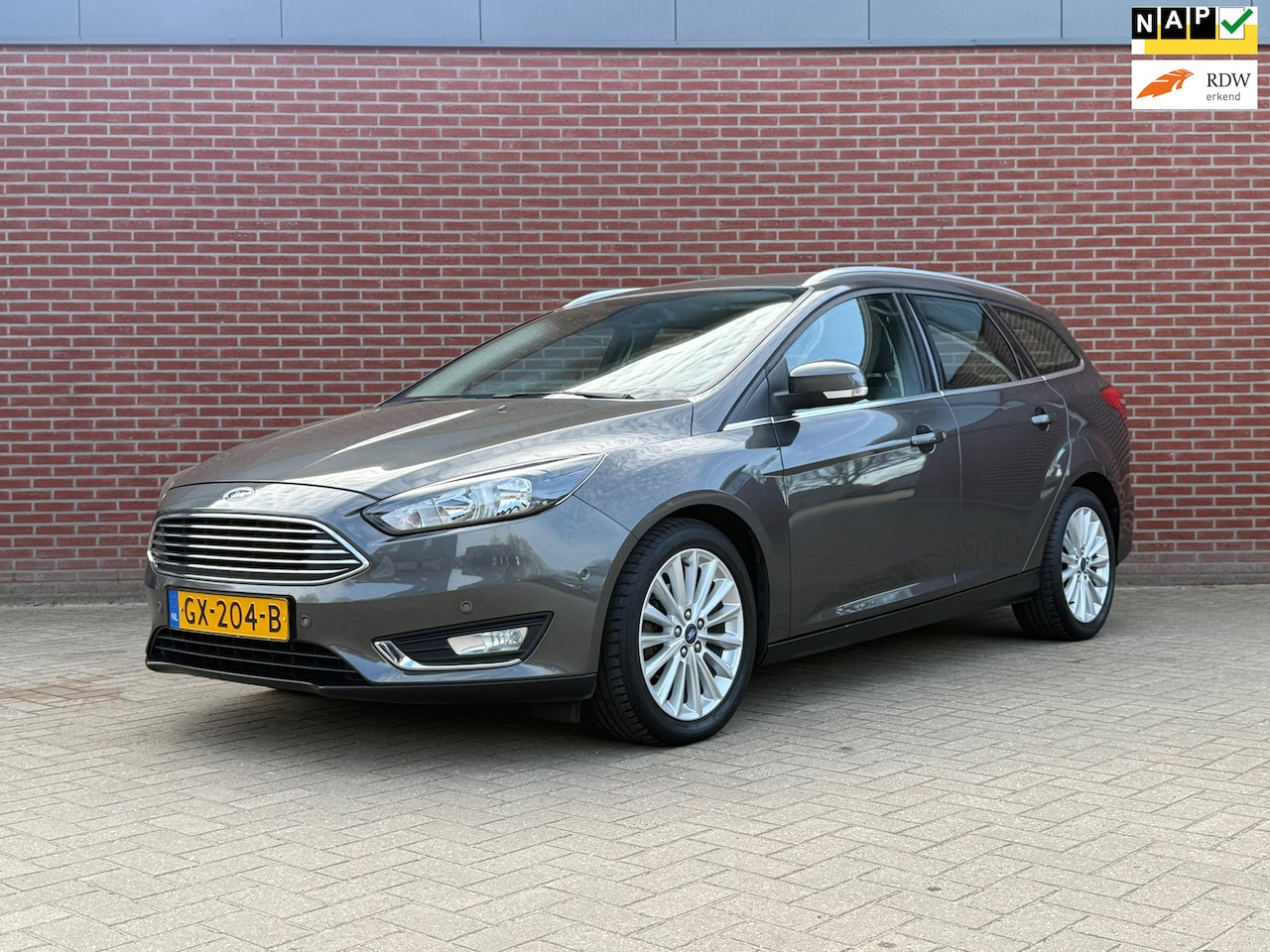Ford Focus Wagon - 1.0 Titanium Edition / Nap / Airco / Cruise / PDC / Trekhaak - AutoWereld.nl