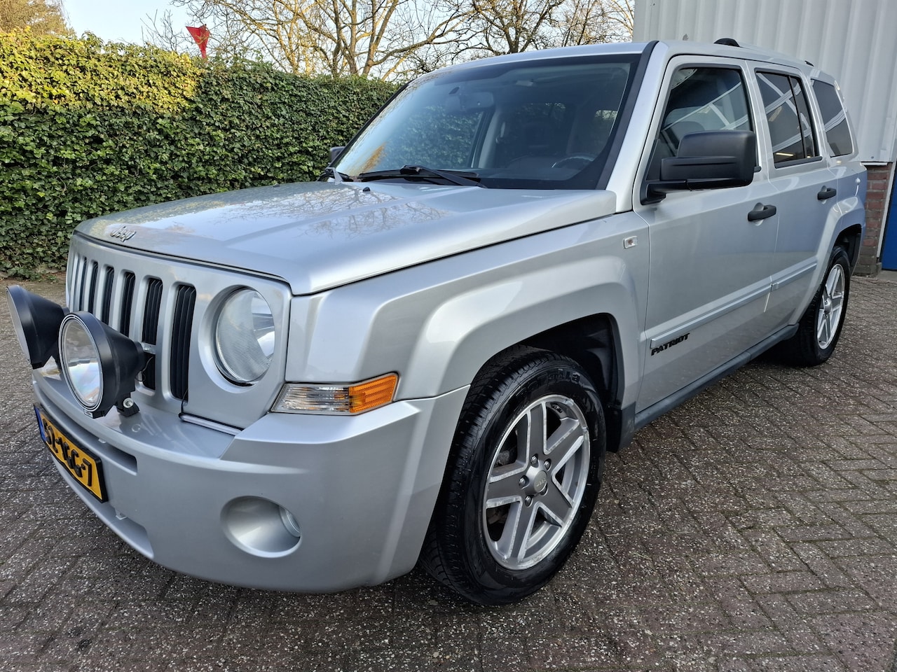Jeep Patriot - 2.4 Limited 4WD/LEER/ZONNEDAK/TREKHAAK/CRUISE/NAVI 170PK - AutoWereld.nl