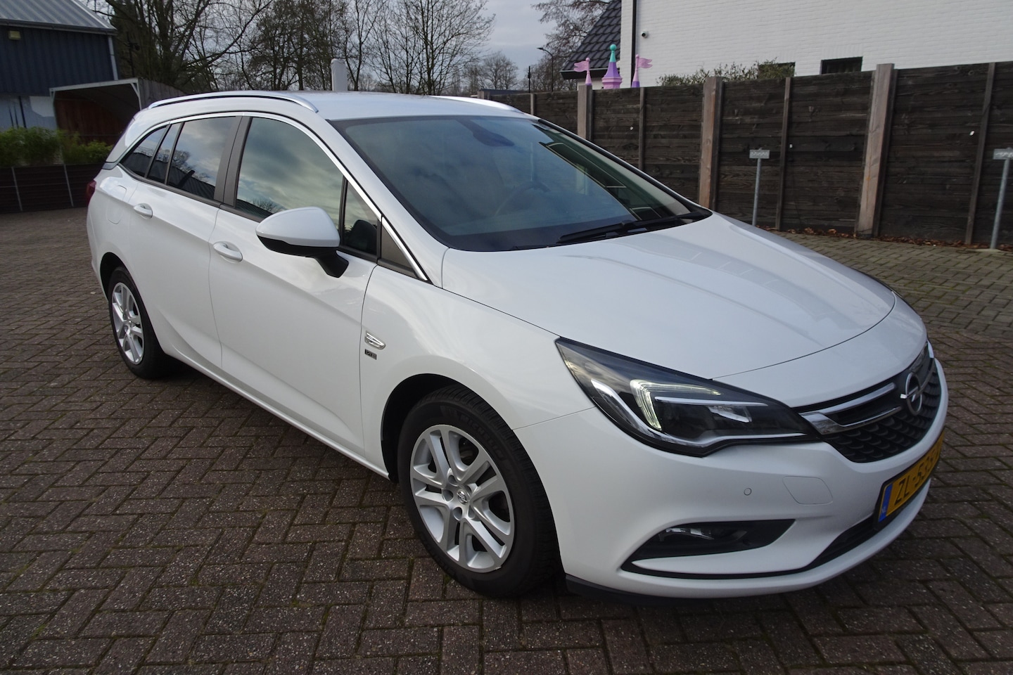 Opel Astra Sports Tourer - 1.0 Turbo 120 Jaar Edition STATIONCAR * AIRCO * LMV * NAVI * CAMERA * - AutoWereld.nl