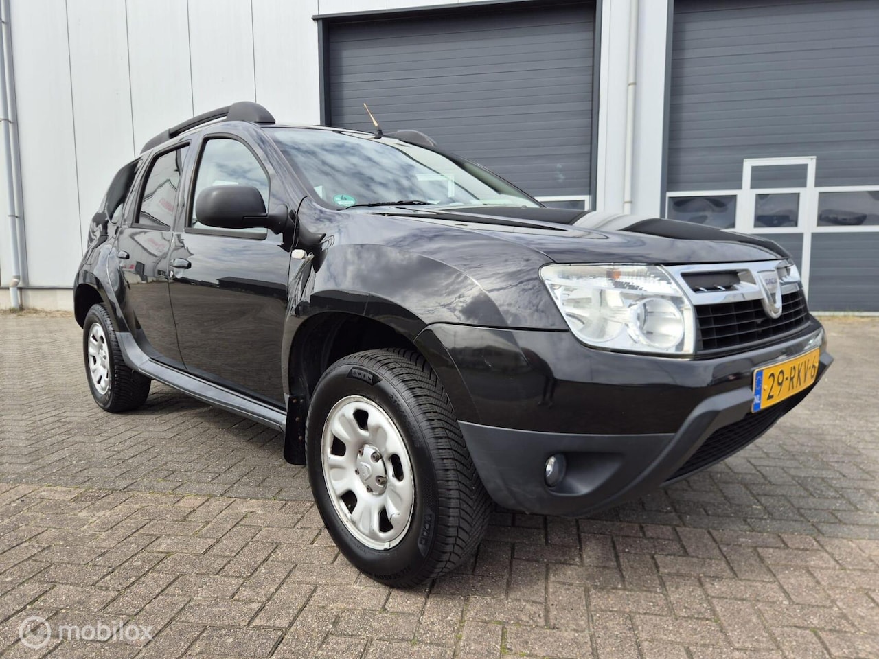Dacia Duster - 1.6 Lauréate 2wd | Airco | Trekhaak - AutoWereld.nl