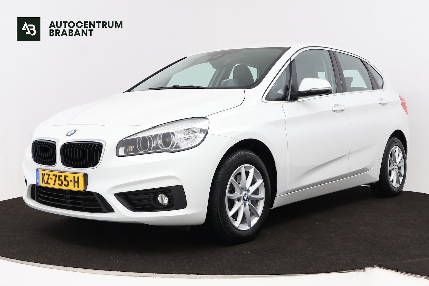 BMW 2-serie Active Tourer - 218i Centennial High Executive (STOELVERWARMING, HEAD-UP, PDC, NAVI, LEDER, LED) - AutoWereld.nl