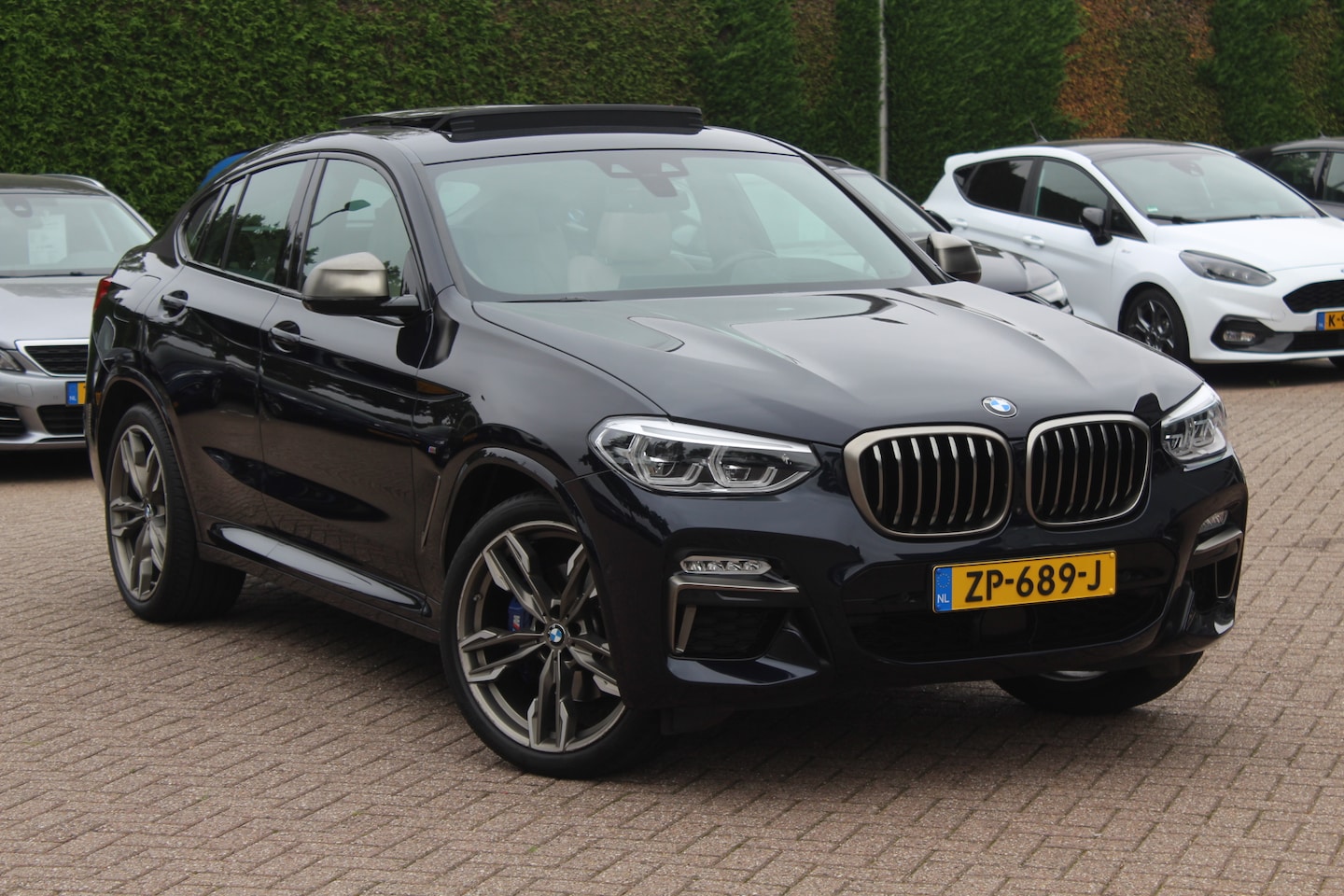 BMW X4 - M40i High Executive / Trekhaak / Panoramadak / Camera / Head-up / Luxe Leder / 21'' / Harm - AutoWereld.nl