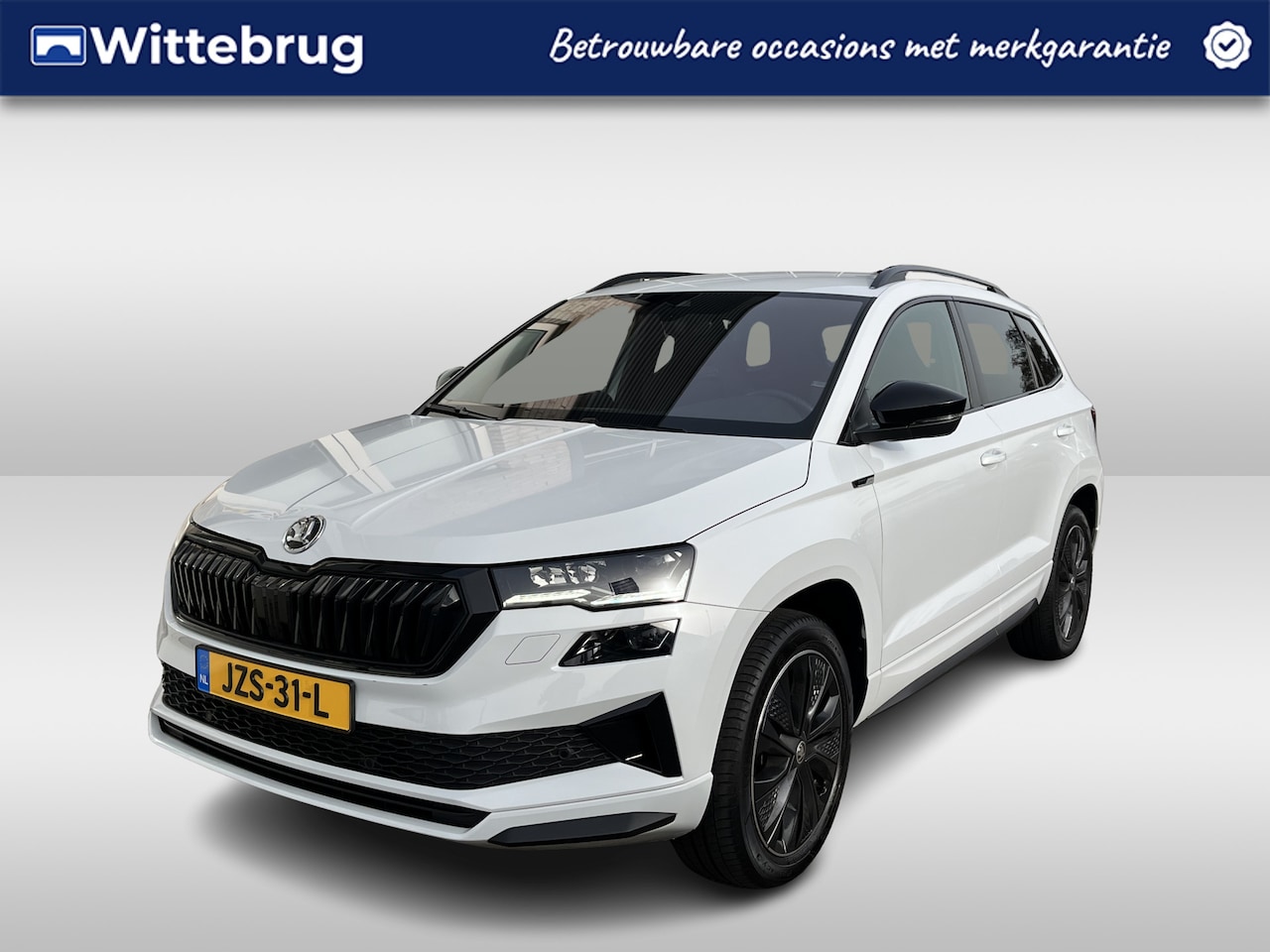 Skoda Karoq - 1.5 TSI ACT Sportline Business / TREKHAAK/ STUUR+STOELVERWARM.V+A/ PARK.SENSOR.V+A/ CAMERA - AutoWereld.nl