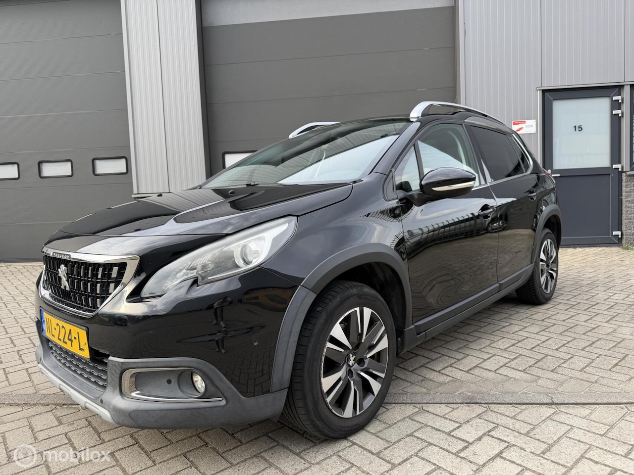 Peugeot 2008 - 1.2 PureTech Allure| Pano | Camera | Leder | - AutoWereld.nl