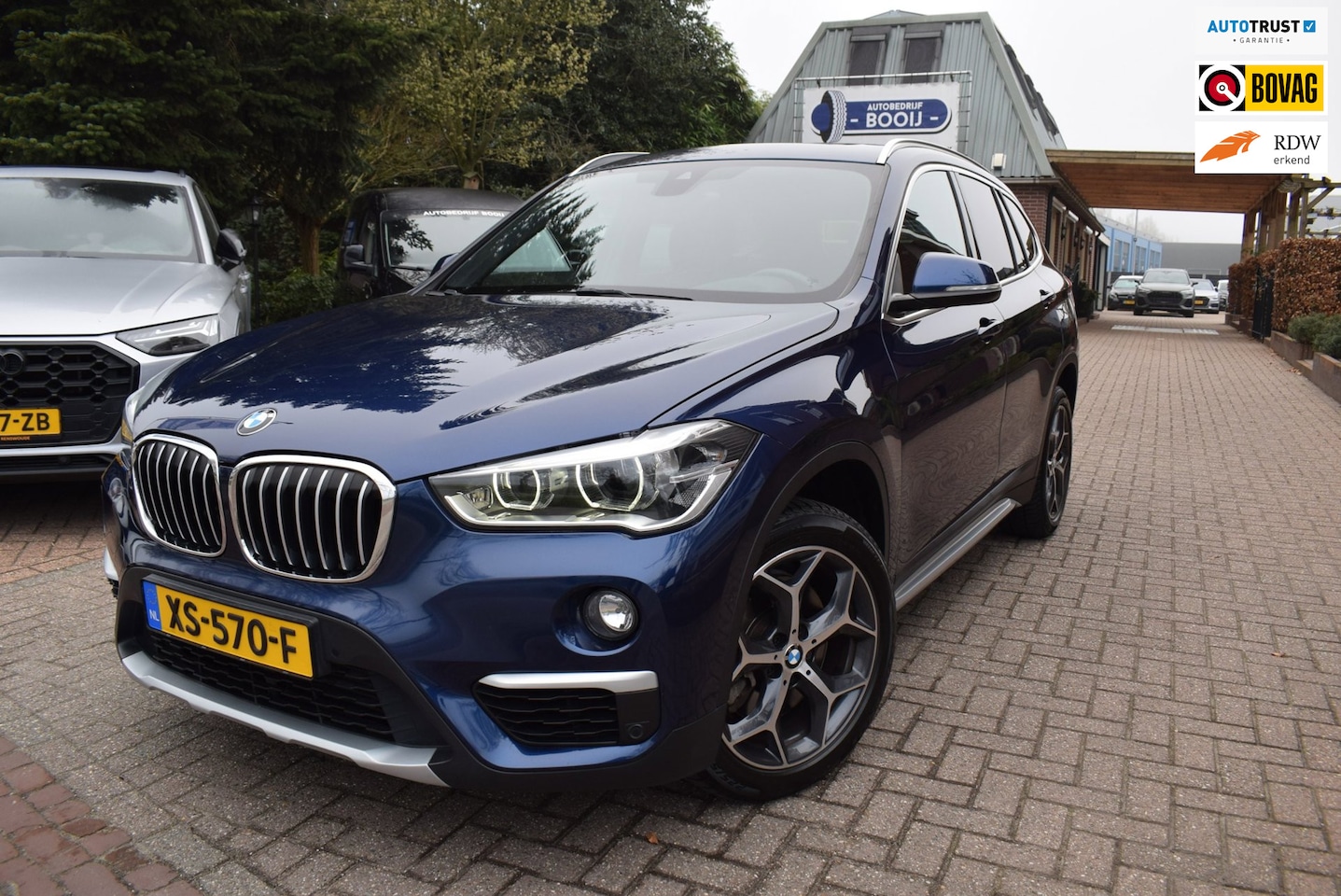 BMW X1 - SDrive20i Orange Edition III AUTOMAAT/PANO DAK/CRUISE/NAVI/TREKH/NL-AUTO/HEAD-UP/STOEL VER - AutoWereld.nl