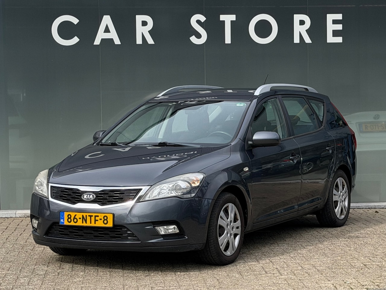 Kia Cee'd - 1.4 CVVT X-ecutive 1.4 CVVT X-ecutive - AutoWereld.nl