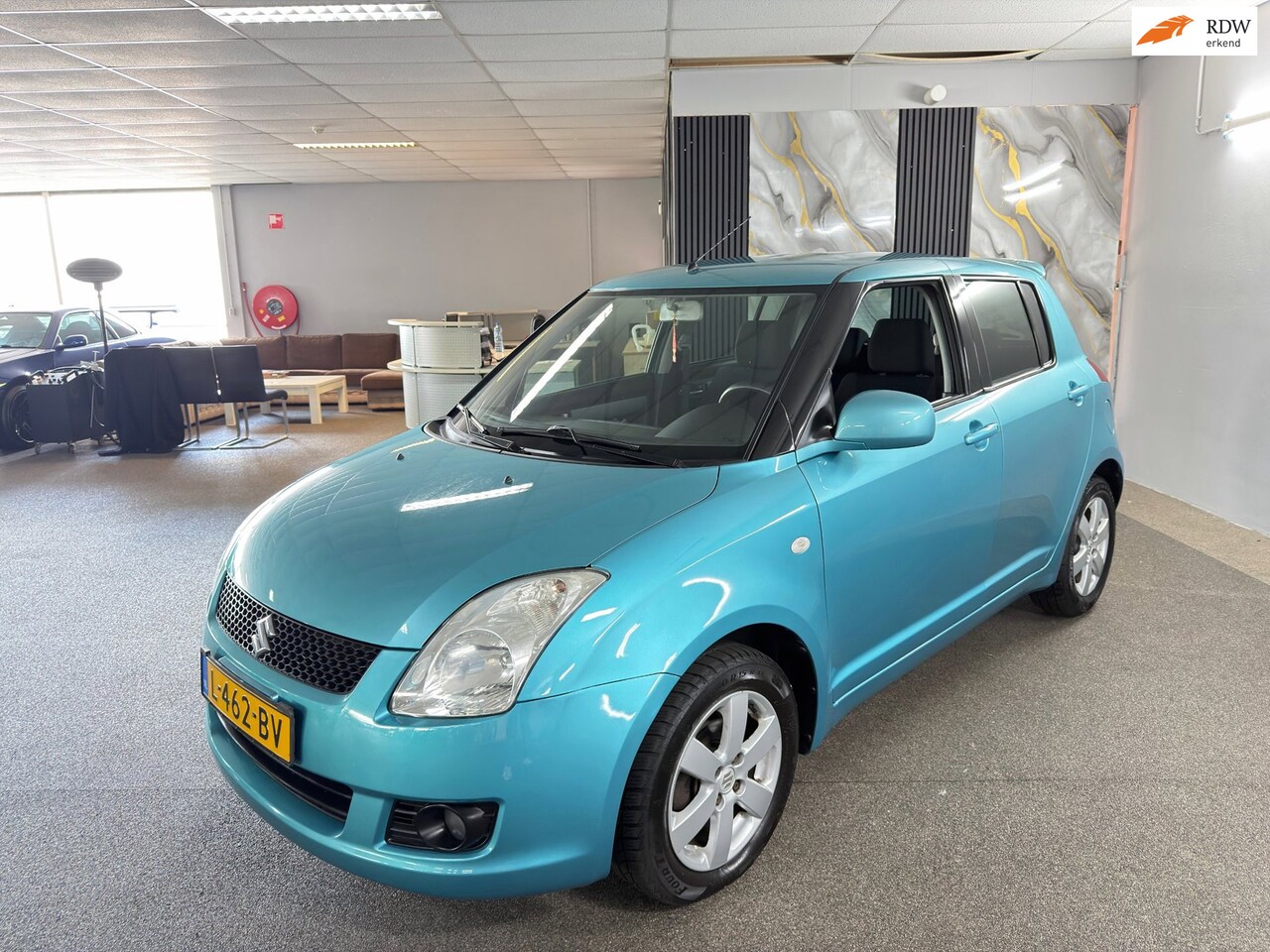 Suzuki Swift - 1.3 Base Apk Nieuw,Airco,E-Ramen,Lm velgen,N.A.P,Spoiler,2 sleutels+boekjes,Topstaat!! - AutoWereld.nl
