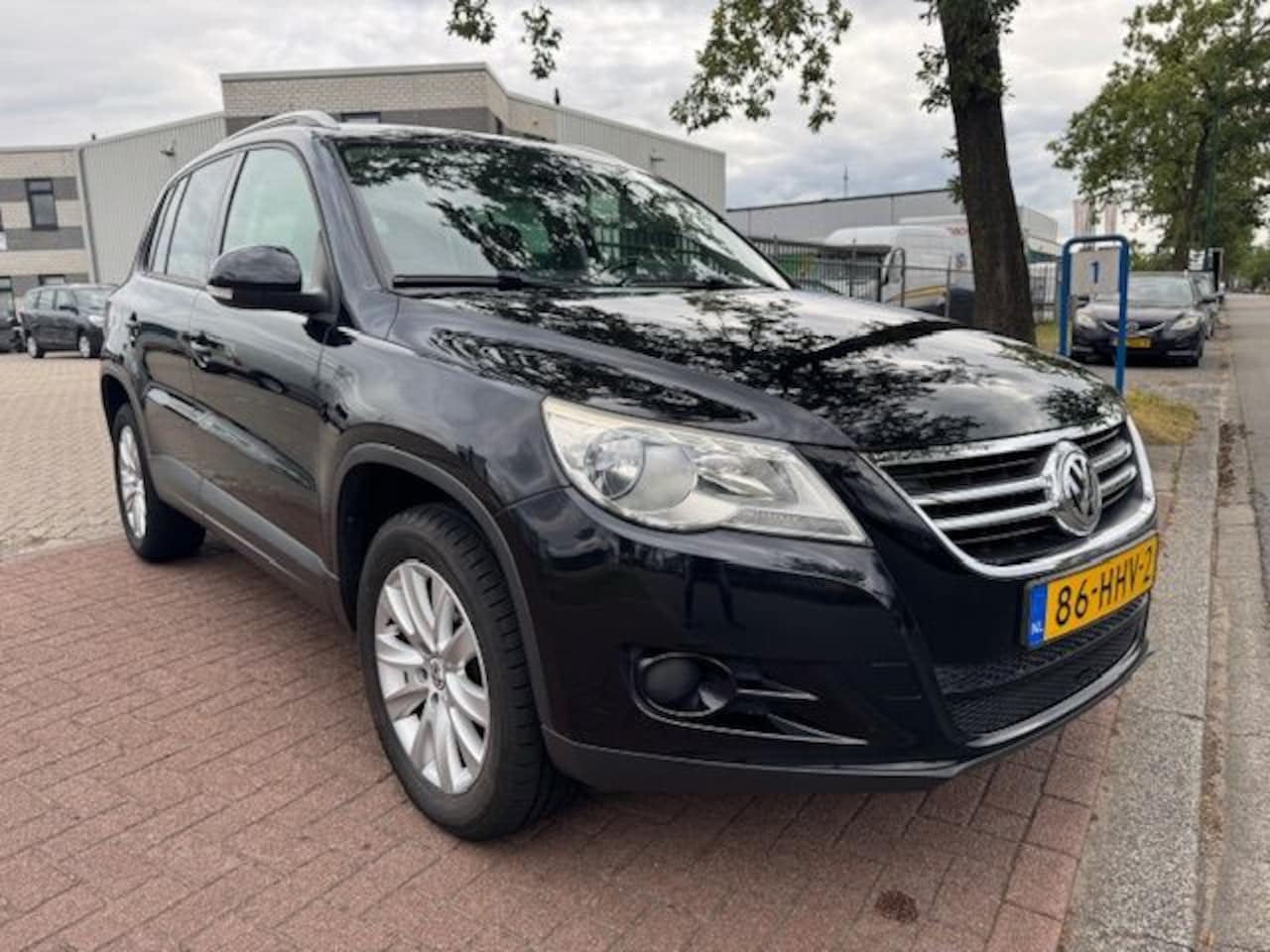 Volkswagen Tiguan - 1.4 TSI 150pk Sport&Style Airco/ECC,Cruisecontrol,Navigatie - AutoWereld.nl