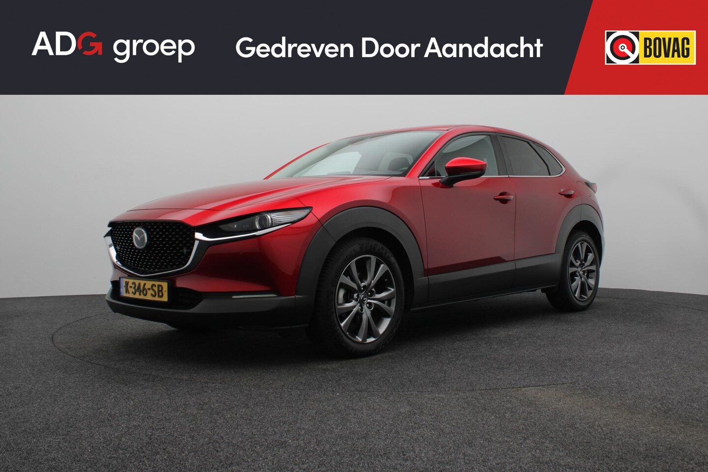 Mazda CX-30 - 2.0 e-SkyActiv-X M Hybrid Luxury | Stuurverwarming |Stoel verwarming |  Red Crystal | gara - AutoWereld.nl