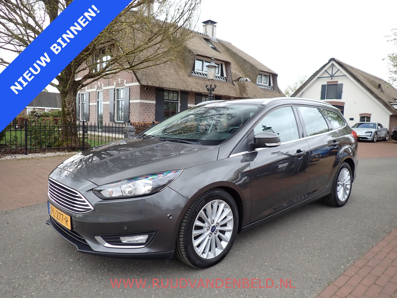 Ford Focus Wagon - 1.5 Titanium / CRUISE / STOELVERWARMING / NAVI / BLUETOOTH - AutoWereld.nl
