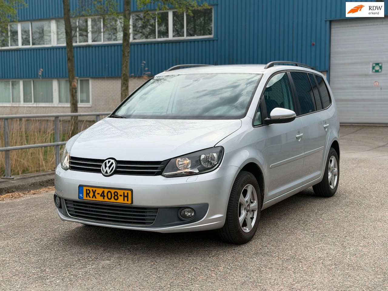 Volkswagen Touran - 1.2 TSI Easyline 7persoons! Navi! PDC! APK! - AutoWereld.nl