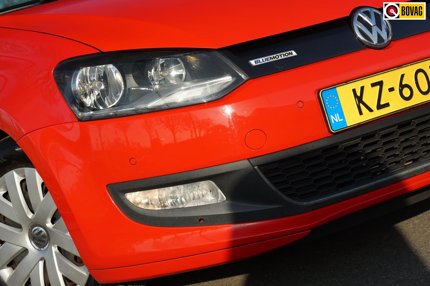 Volkswagen Polo - 1.0 BlueMotion Edition| Flash Red | Navi/Cruise/Bluetooth/AC - AutoWereld.nl