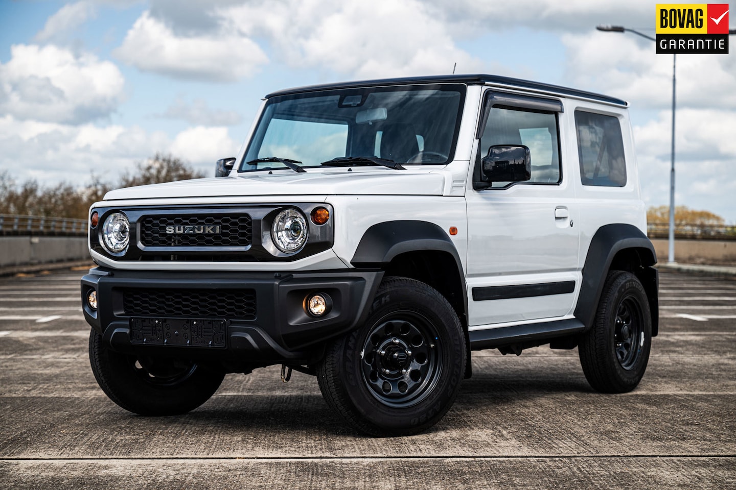 Suzuki Jimny - 1.5 Stijl | 4 Persoons | Airco/Clima | Cruise Control | Navigatie | Stoelverwarming | Trek - AutoWereld.nl