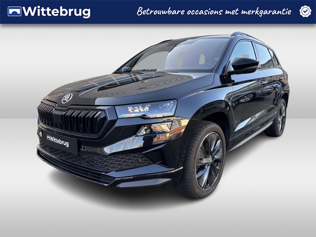Skoda Karoq - 1.5 TSI ACT Sportline Business Panoramadak / Lederen interieur / Navigatie / Elektrisch ve - AutoWereld.nl