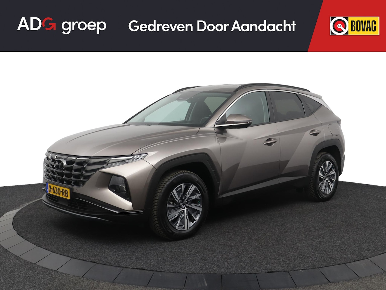 Hyundai Tucson - 1.6 T-GDI HEV Comfort | Parkeercamera | Navigatie | Trekhaak | Keyless Entry - AutoWereld.nl