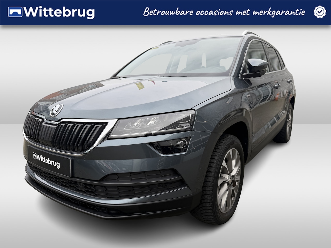 Skoda Karoq - 1.0 TSI Ambition Clever Sunset Wireless App-Connect / Achteruitrijcamera / Verwarmbare sto - AutoWereld.nl