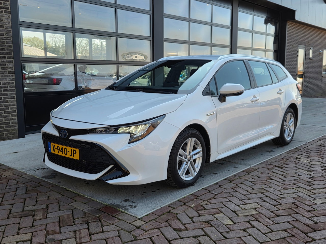 Toyota Corolla Touring Sports - 1.8 Hybrid Active |Stoelver | Navi | Clima | Camera | - AutoWereld.nl