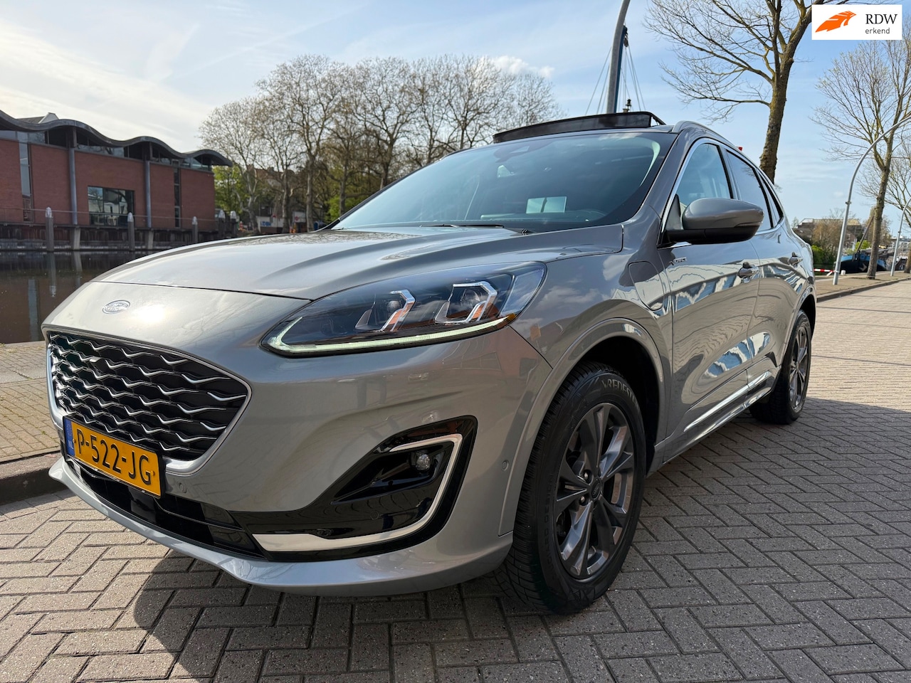 Ford Kuga - 2.5 PHEV Vignale_PANORAMADAK_LEER_NETTE AUTO - AutoWereld.nl