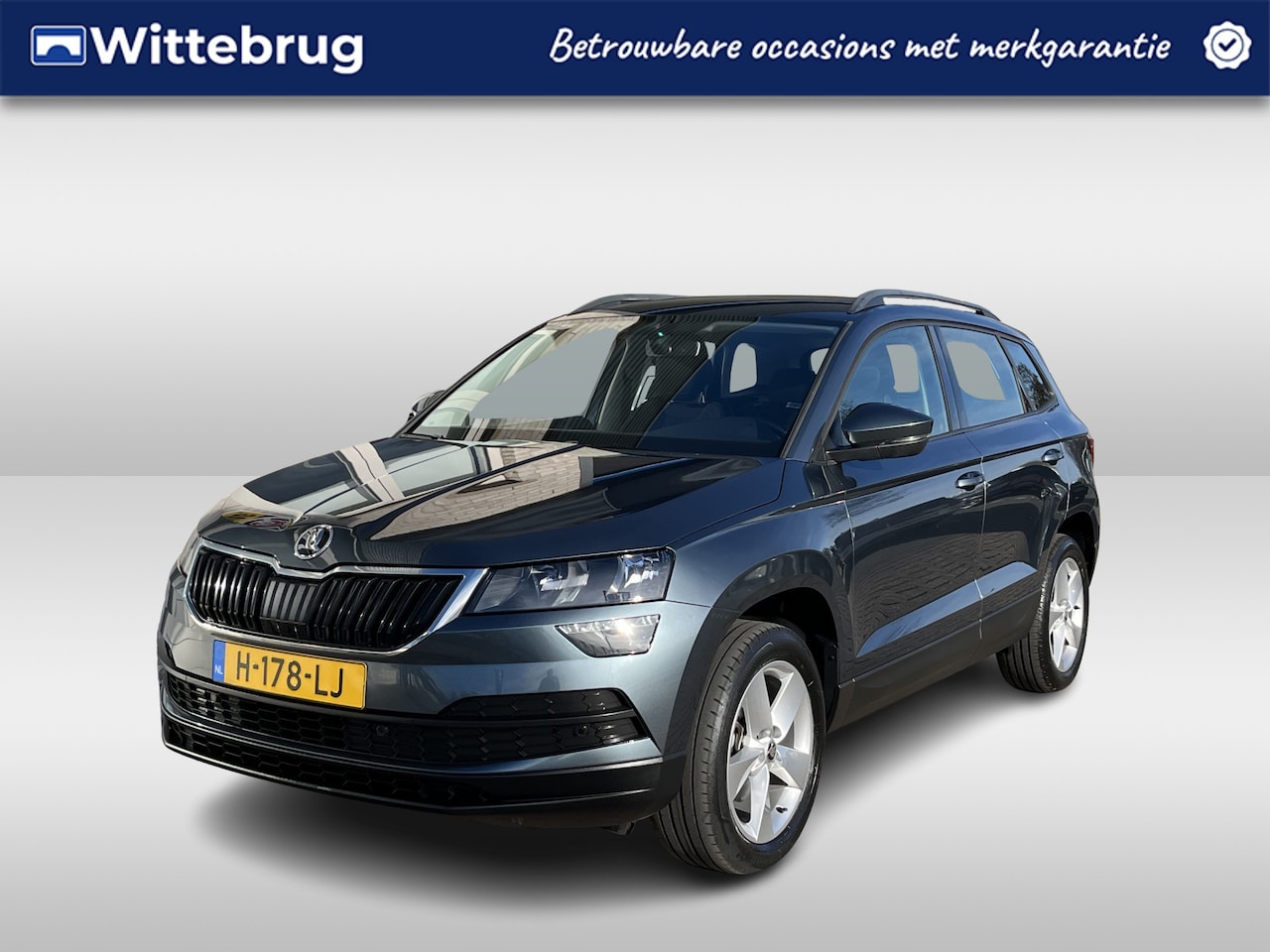 Skoda Karoq - 1.0 TSI Ambition Business / AUTOMAAT/ CRUISE/ NAVI/ SMARTLINK/ CLIMA/ DAB/ PARK. SENSOREN/ - AutoWereld.nl