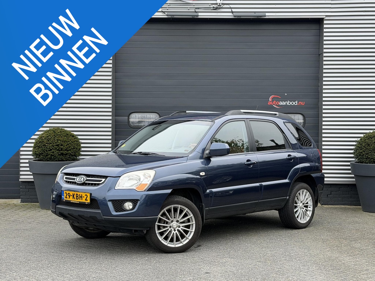 Kia Sportage - 2.0 CVVT X-clusive | Airco | Cruise Control | Parkeersensoren | 18 Inch Lichtmetalen Velge - AutoWereld.nl