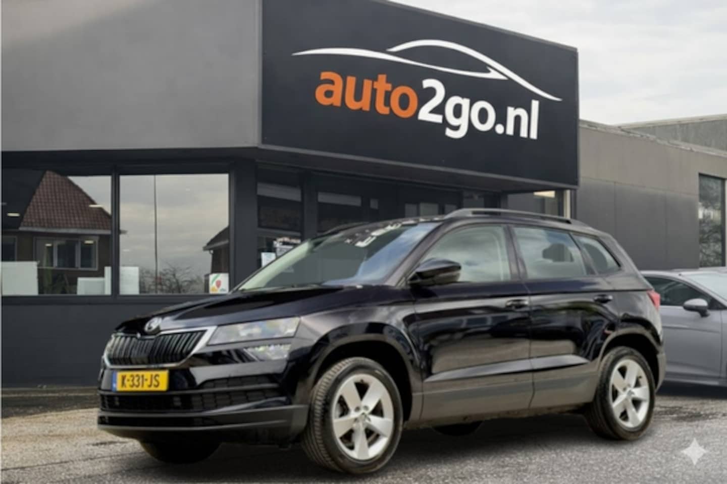 Skoda Karoq - 1.0 TSI EDITION DESIGNO-INT NAVI AIRCO APPLE-CARPLAY PARK-ASSIST LED LMV PDC - AutoWereld.nl