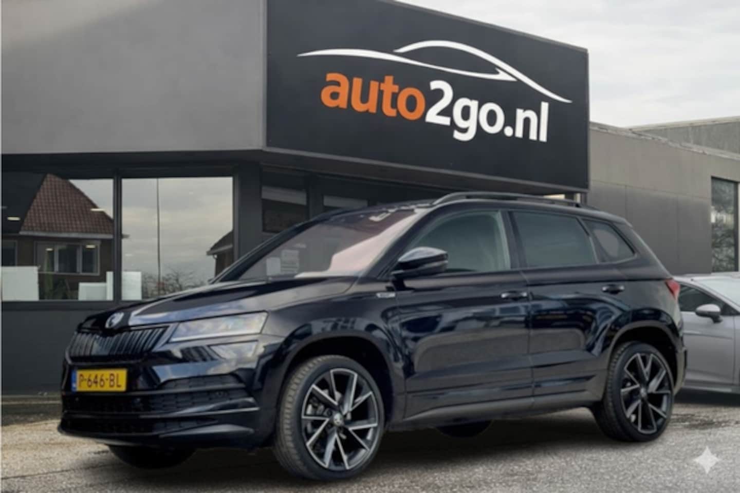 Skoda Karoq - 1.5 TSI ACT AUT7 SPORTLINE NAVI CAMERA DIGI-DASH APPLE-CARPLAY LED LMV PDC - AutoWereld.nl