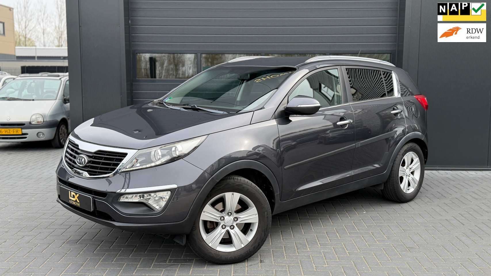 Kia Sportage - 2.0 X-ecutive Plus Pack Airco|Trekhaak - AutoWereld.nl