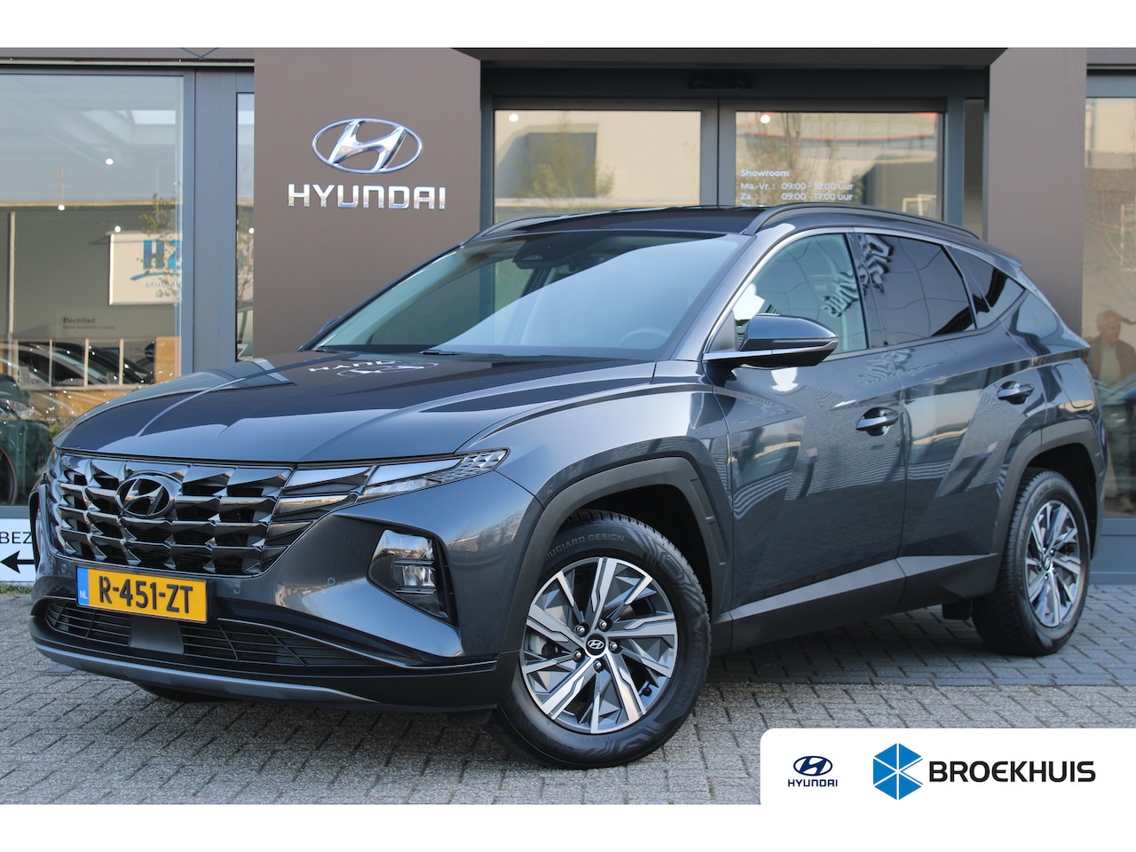 Hyundai Tucson - 1.6 T-GDI HEV Comfort | Achteruitrijcamera | Afneembare Trekhaak | Airco (automatisch) - AutoWereld.nl