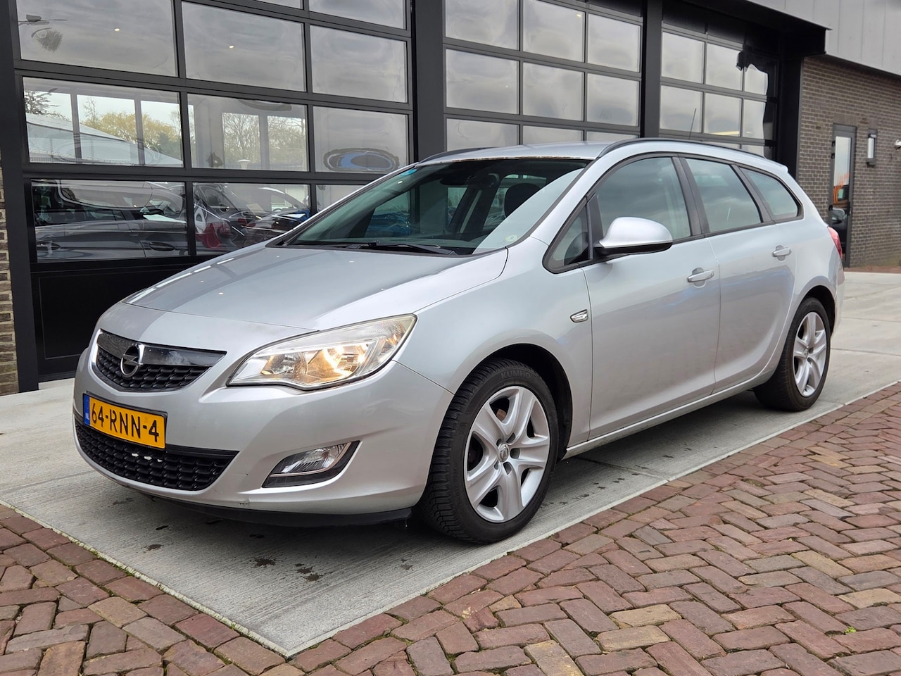 Opel Astra Sports Tourer - 1.7 CDTi Edition | Airco | Cruise | - AutoWereld.nl