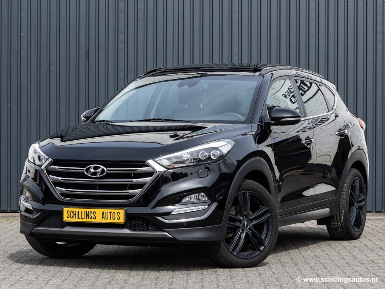 Hyundai Tucson - 1.6 T-GDI PREM. 4WD Automaat Leer Navi panoramadak 68.000km! - AutoWereld.nl