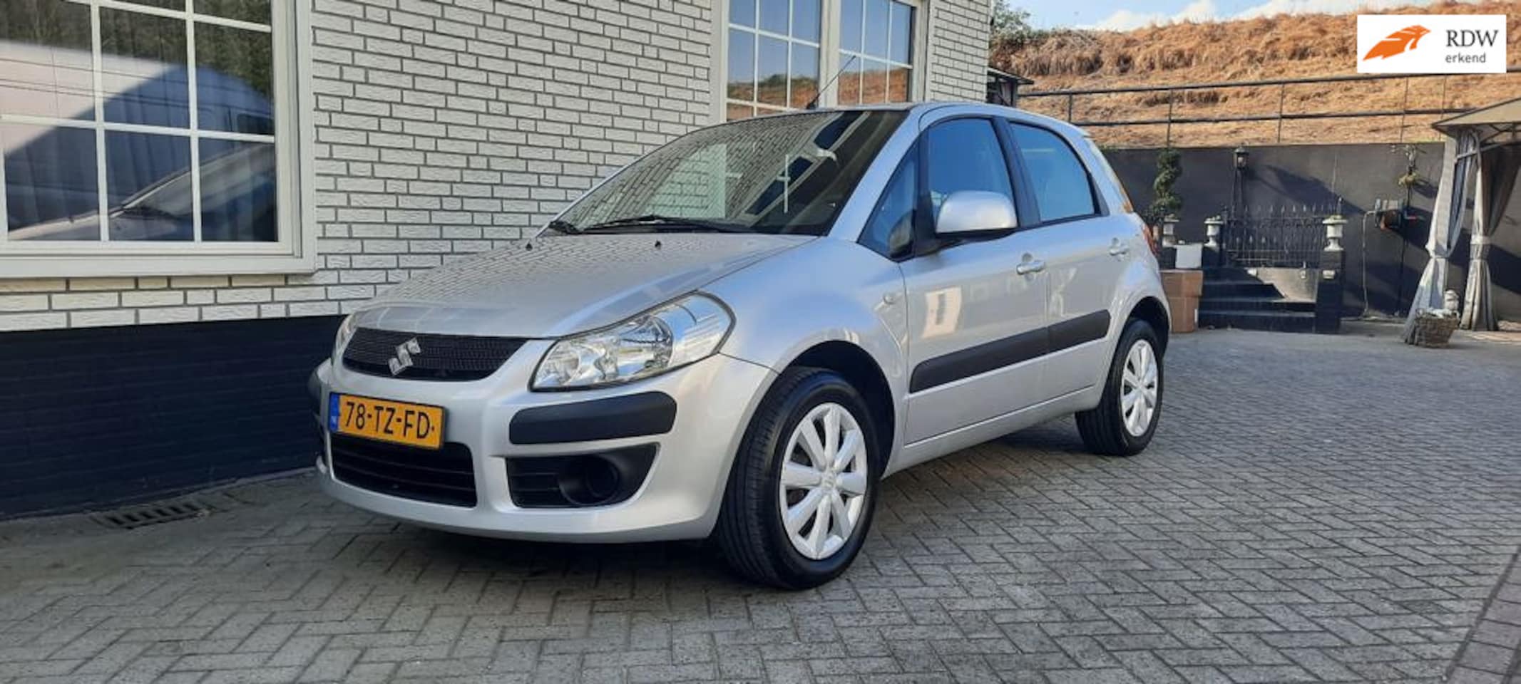 Suzuki SX4 - 1.6 Comfort 4 deurs-hoge instap - AutoWereld.nl