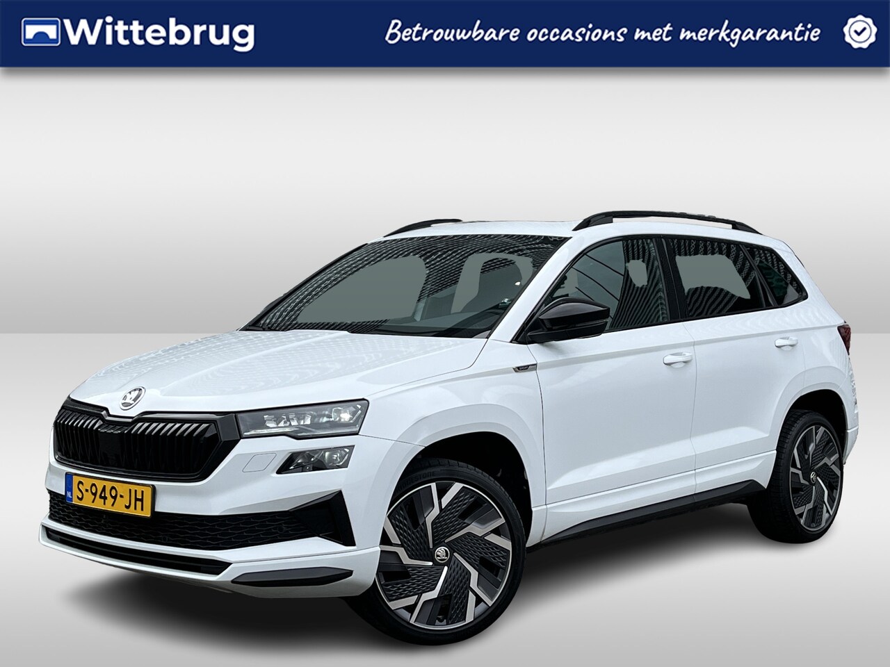 Skoda Karoq - 1.5 TSI ACT Sportline Business / Digitaal dashboard / Pano / Navigatie / App connect / Cam - AutoWereld.nl