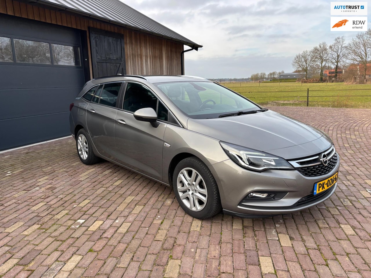 Opel Astra Sports Tourer - 1.0 Online Edition 1.0 Online Edition, CARPLAY, NAVIGATIE,TREKHAAK. - AutoWereld.nl