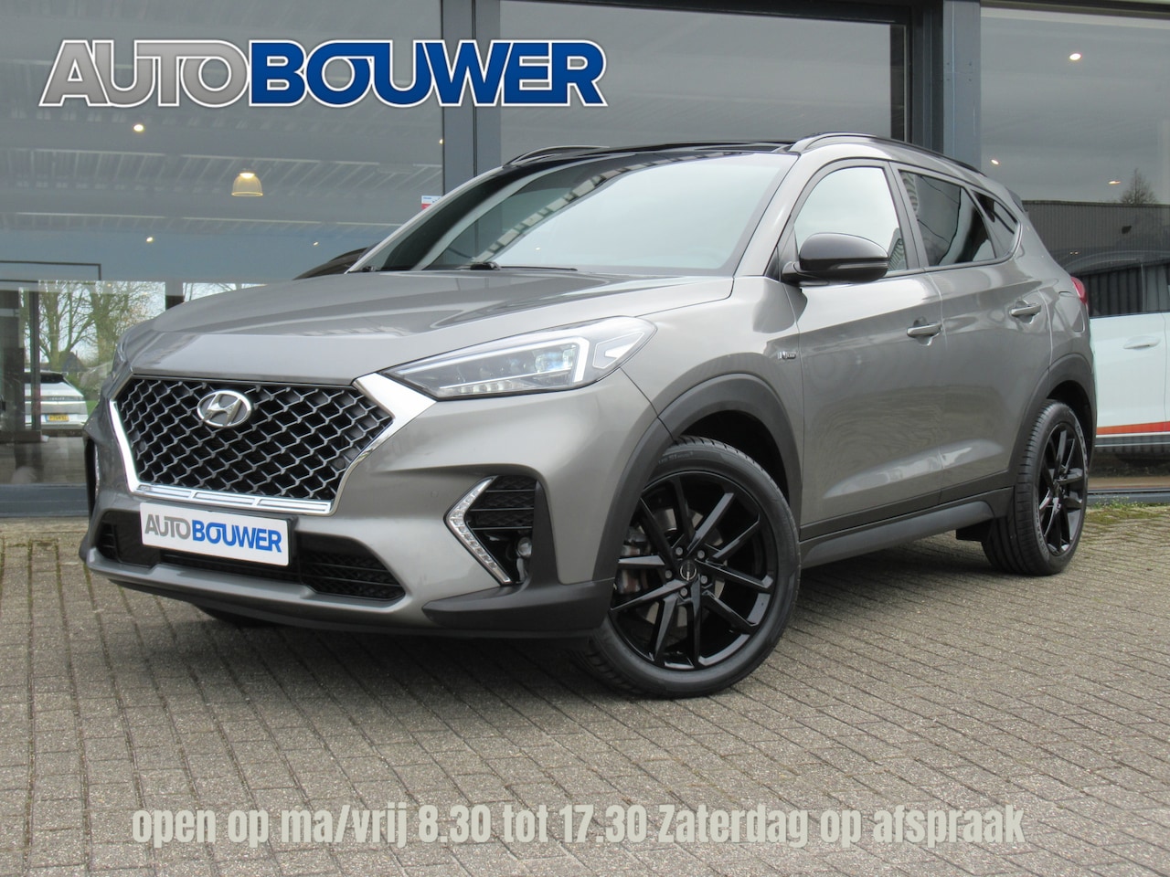 Hyundai Tucson - 1.6 T-GDI 177 PK 4WD N-Line 2e eigen | dealer onderh | panodak | full option! - AutoWereld.nl