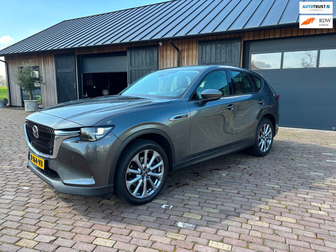Mazda CX-60 - 2.5 E-SKYACTIV PHEV Exclusive-Line 2.5 e-SkyActiv PHEV Exclusive-Line,LEER.NAVIGATIE ,CAMERA ,HUD,ADAPTIEVE CRUISE,HAAK. - AutoWereld.nl
